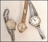 A 375 / 9ct gold Excaliber ladies dress watch on yellow metal expanding bracelet ( af ) together