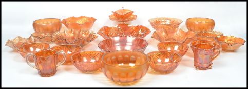 A good collection of vintage 20th century Carnival glass in the orange colourway to include