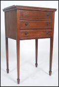 An Edwardian mahogany work box table chest being raised on square tapered legs with spade feet, bank