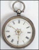 An early 20th century silver 835 marked ladies open faced key wind pocket for watch. Rococo chased