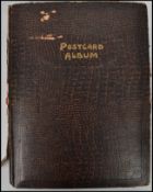 Postcards; An Edwardian greetings / postcard album, filled with assorted greetings cards of the