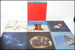 A collection of long play vinyl LP records to include Paul McCartney / Wings and Dire Straits to