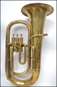A vintage 20th century brass tuba musical instrument by A Hall Gisborne makers to H M Forces