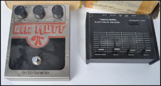 A vintage Realistic Electronic Guitar Reverb in the box together with boxed Big Muff guitar foot