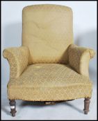 A Victorian large Chesterfield armchair being raised on turned legs with overstuffed seat frame