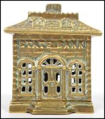 A vintage 20th century brass novelty State Bank money box raised on plinth base. Measures  12cm