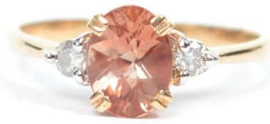 A 14ct yellow gold pink tourmaline and diamond ladies dress ring complete in the presentation