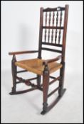 A 19th century North Country - Lancashire country oak ladderback rocking chair / armchair being