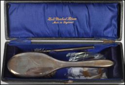 A silver hallmarked ladies brush and comb set bearing hallmarks for Chester 1919 makers J & R