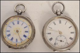 An early 20th century rococo chased ladies silver fob watch with key wind having open face with