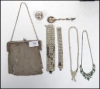 A group of vintage silver white metal items and rhinestone necklaces to include a chain mesh
