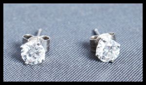 A pair of white gold diamond prong set stud earrings of approx 70pnts total with post backs and