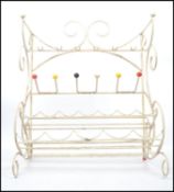 A mid 20th century sputnik atomic plastic coated wire work wine rack and glass holder with