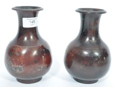 A pair of believed 19th century Japanese bronze and enamel painted oriental vases. Each of
