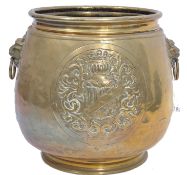 A 19th century Victorian brass jardiniere / coal bin having a large circular armorial crest with
