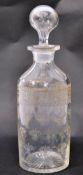 A 19th century Regency hand cut and etched glass decanter. Of cylindrical form with stunning fleur