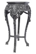 A 19th century Chinese carved hardwood plant stand - jardiniere. Of upright orm  with circular inset