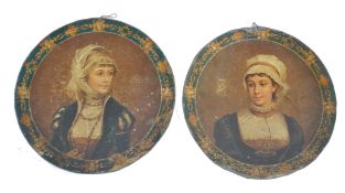 A pair of 19th century painted tin toleware wall plaques each being adorned with central classical