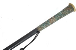 A 19th century Victorian walking stick cane having a tapering ebony shaft with sliver band collar