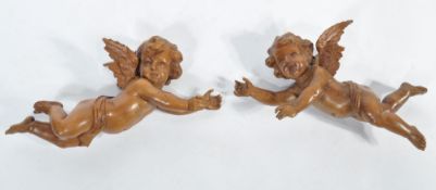 A stunning pair of 19th century carved swiss / black forest wooden cherubs - putti. Each of winged