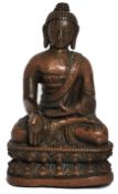 An 18th century small Nepalese / Chinese coppery bronze hollow cast figure sculpture of a buddha -
