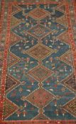 A 19th century handwoven Kurdish small rug with geometric designs having a run of central medallions