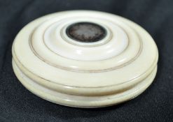 A fine and extremely rare mid 19th century turned ivory yo-yo. The stepped circular shape having