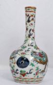 A Chinese porcelain vase being hand painted, 17th / 18th century Qing dynasty. Of baluster form with