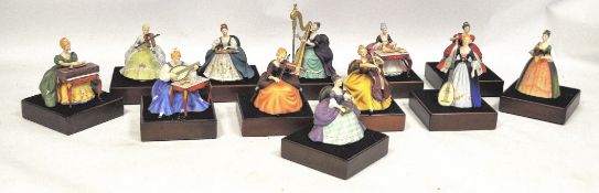 A complete collection of Royal Doulton musicians figures / figurines by ceramicist Peggy Davies . To