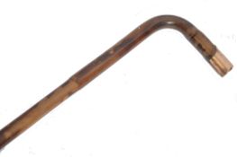 A 19th century Victorian palmwood walking stick cane having a tapered shaft with shaped handle and