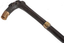 A 19th century Victorian walking stick cane having a tapering dark wood shaft with shaped nobbled