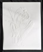 A 19th century lithophane panel depicting a violin , a rolled up musical score and a herdy-gurdy?