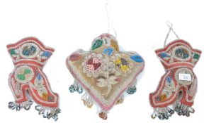 A pair of mid 19th century North American glass bead work hanging wall pockets each in the form of a