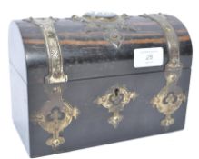 A mid 19th century brass bound coromandel wood domed top box having brass escutcheon with prunted