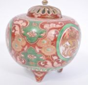 A 19th century Chinese / Japanese tri-colour ball base raised on tripod feet having cartouche