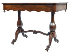 An exquisite 19th century rosewood writing table desk. Raised on hexagonal baluster columns united