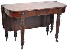 A late 18th century mahogany Gillows concertina action extending dinning table raised on fluted legs