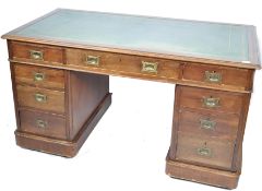 A 19th century large mahogany twin pedestal campaign desk. Each pedestal being raised on plinth