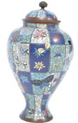 A 19th century Japanese / French bronze enamel champleve decorated vase urn having colourful