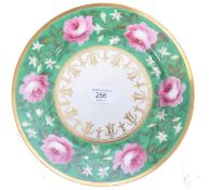An early 19th century Chamberlain Worcester cabinet plate  decorated with rose flowers  to a green