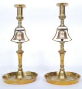 A very good finely detailed pair of brass tavern candlesticks with bell metal bells incorporated