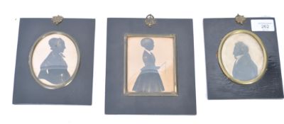 A set of 3 / family group of 19th century Georgian silhouettes being framed and glazed. 2 within