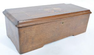 A Georgian 19th century mahogany and marquetry inlaid cylinder music box having hinged lid with