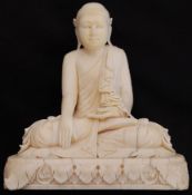 A 19th century Ivory Thia buddha deity carved sculpture seated on a flat pedestal with swag
