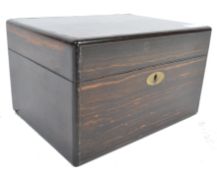 A 19th century coromandel and brass bound decanter ladies travelling dressing table box. Of square