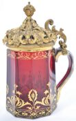 An exceptional 19th century cranberry glass and git metal ormulu mounted lid tankard. The