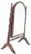A 19th century quality rosewood dressing table mirror being raised on splayed legs united by a