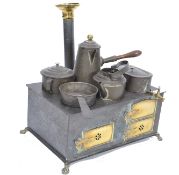 An early 20th century C1900 Marklin cooking stove of tinplate construction including two spirit