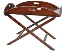 A good Georgian revival mahogany butlers tray and stand. The large tray with brass hinged drop