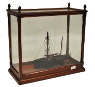 An early 20th century scratchbuilt model of a Hull fishing boat vessel. The mahogany case with